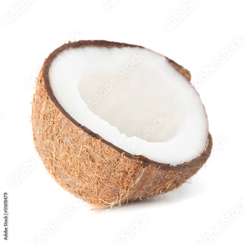 two coconut halfs with milk isolated on white