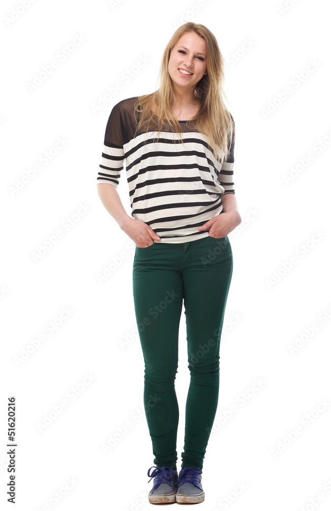 Portrait of a beautiful young woman with hands in pockets Portrait of a beautiful young woman with hands in pockets