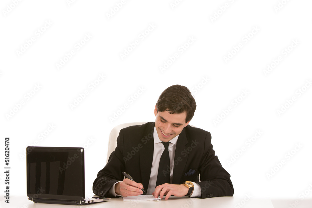 Smiling businessman writing notes Smiling businessman writing notes