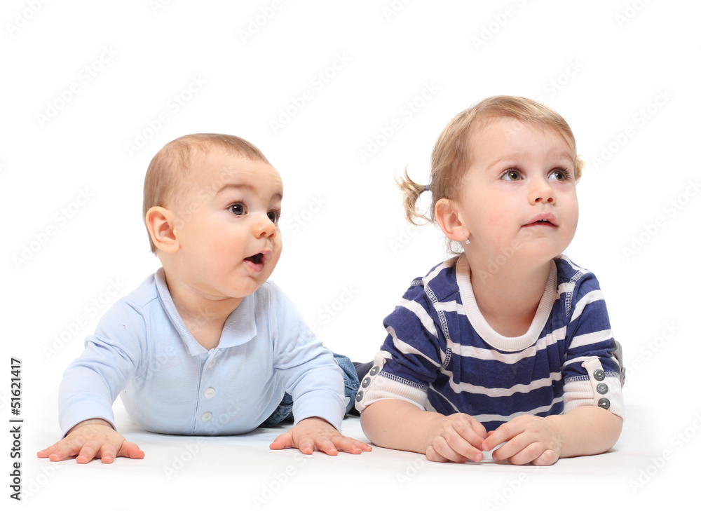 Playing children. An girl with her little brother on a white.. Playing children. An girl with her little brother on a white..