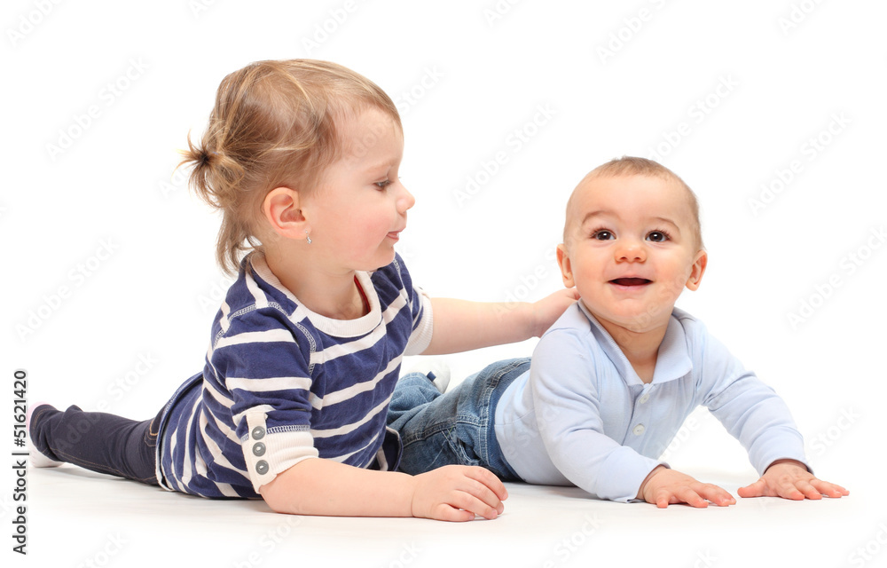 Playing children. An girl with her little brother on a white. Playing children. An girl with her little brother on a white.