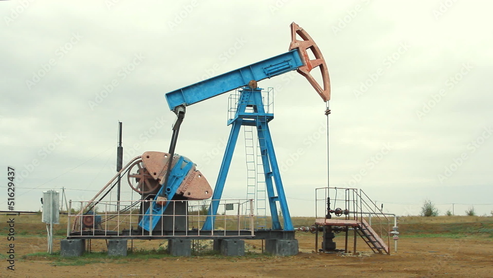 Oil and gas industry. Work of oil pump jack on a oil field. Oil and gas industry. Work of oil pump jack on a oil field.