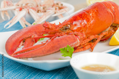 Lobster, browned butter and lemon wedges. Langoustines on the BG
