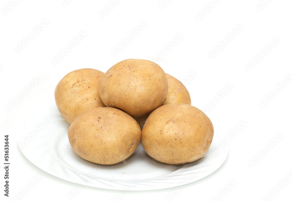 fresh potatoes on the plate on white background fresh potatoes on the plate on white background