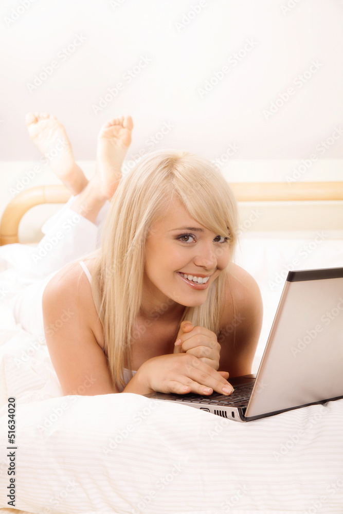 Young woman browsing internet. Selective focus Young woman browsing internet. Selective focus