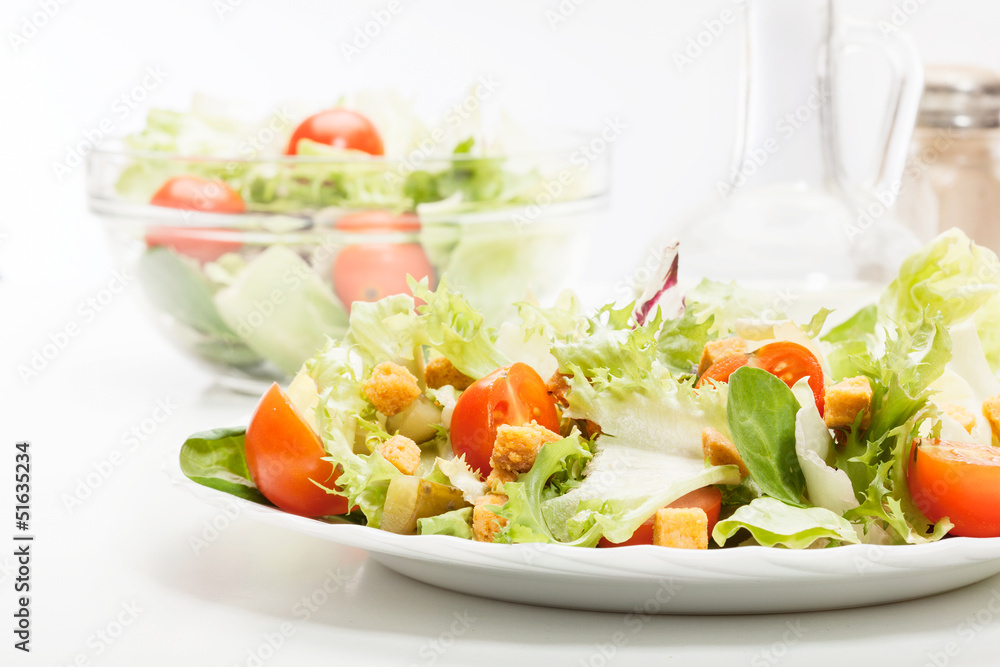Close-up of salad. Lettuce, tomato, cucumber. Selective focus Close-up of salad. Lettuce, tomato, cucumber. Selective focus