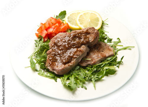 fresh grilled red meat with vegetables and sauce