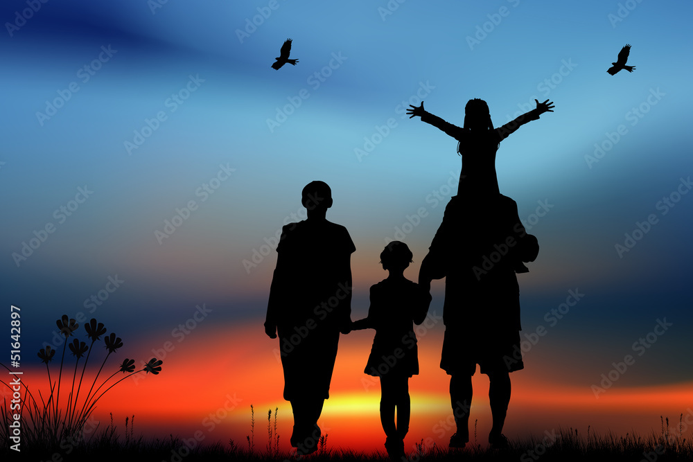 Family with children walk on a sunset