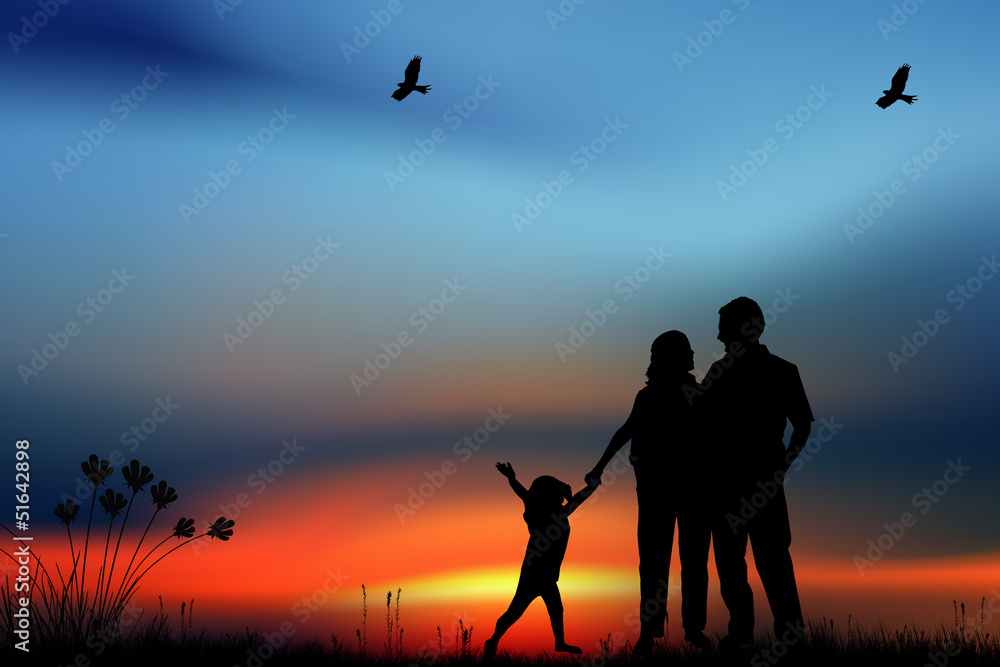 Fototapeta premium Silhouettes of happy parents having good time with their little