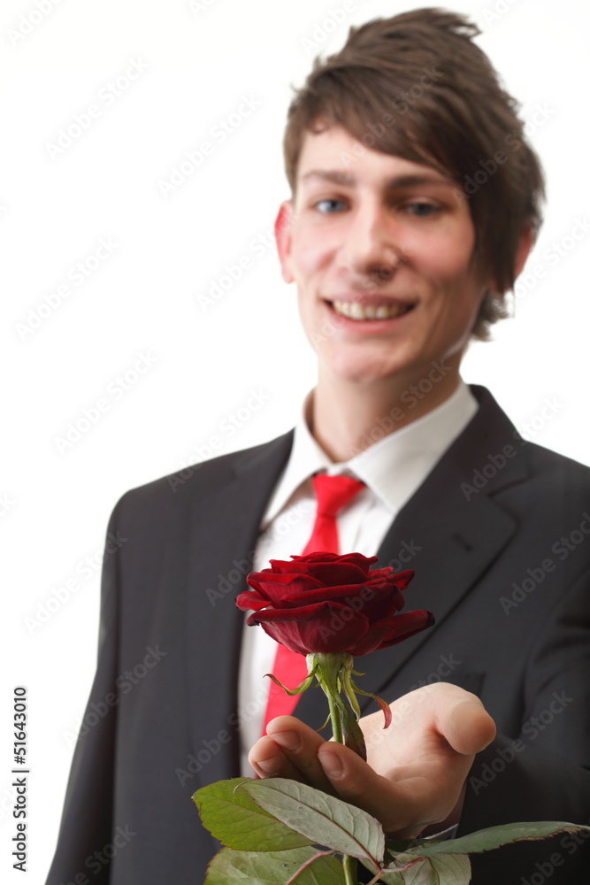 Young man presenting a flower red rose isolated Young man presenting a flower red rose isolated