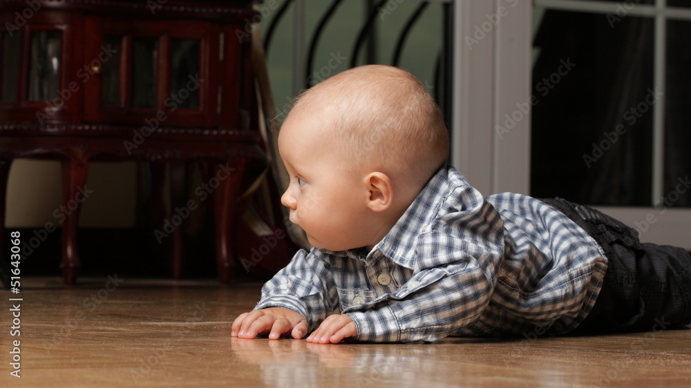 6 months male child sitting on floor 6 months male child sitting on floor