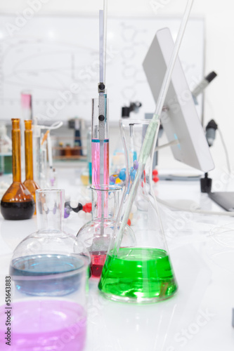 laboratory tools and colorful liquids photo