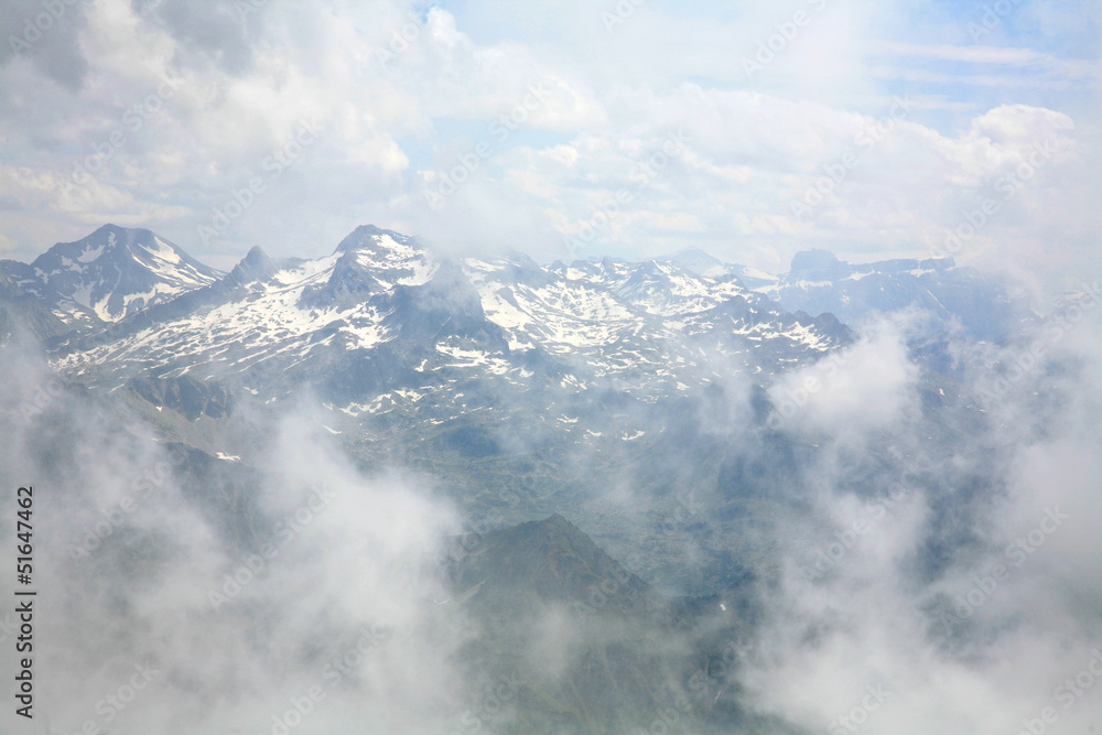 Clouds and pinnacles of French Pyrenees mountains Pic du midi