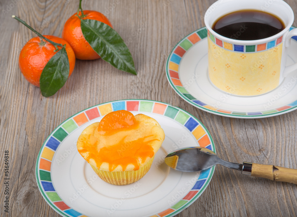 Fresh baked mini clementine cheesecakes in muffin forms Fresh baked mini clementine cheesecakes in muffin forms