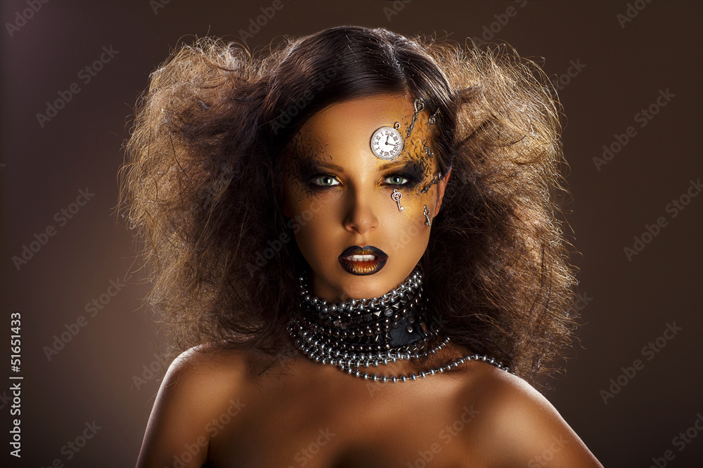 Bronze Face of Beautiful Woman with Silver Watch and Keys Bronze Face of Beautiful Woman with Silver Watch and Keys