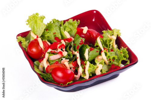 Salad with shrimps on a white background