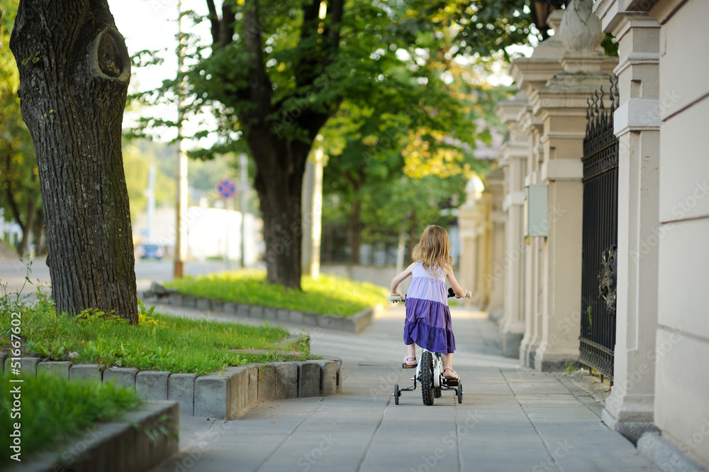 Little girl riding a bike