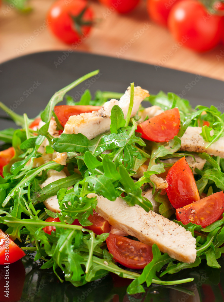 grilled fillet of chicken and a salad of arugula and tomato grilled fillet of chicken and a salad of arugula and tomato
