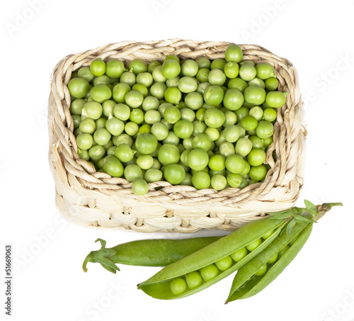 Basket with green peas the isolated.