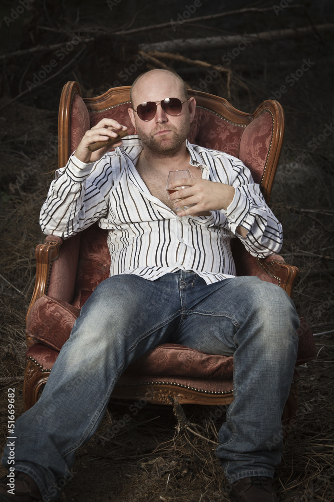 Obraz premium Sleazy Man in a Vintage Chair