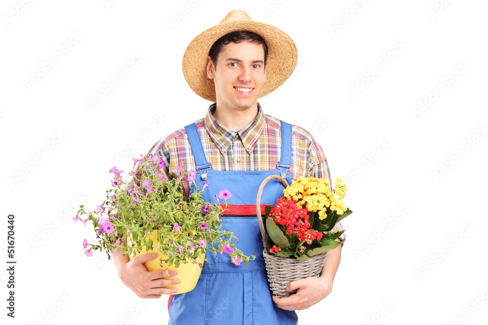 Male gardener holding plants