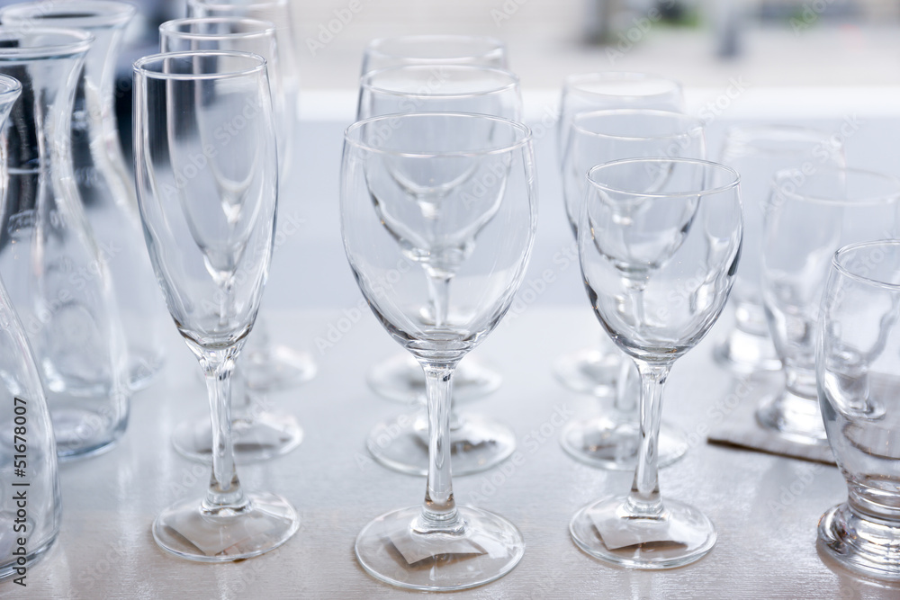 Group of empty crystal clear glasses and bottles Group of empty crystal clear glasses and bottles