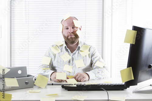 Office Worker with Notes Everywhere photo