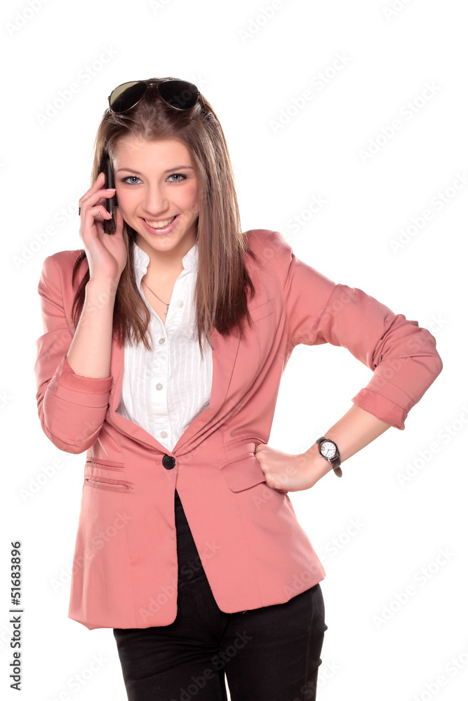 Young teenager girl posing and talking on the phone Young teenager girl posing and talking on the phone