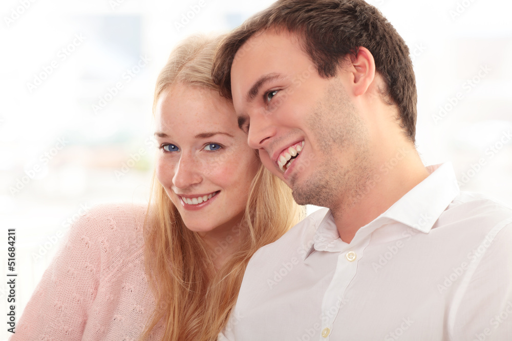 Portrait of a happy couple sitting together Portrait of a happy couple sitting together