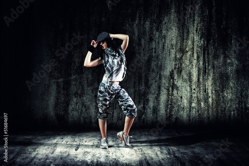 urban dancer with grunge concrete wall