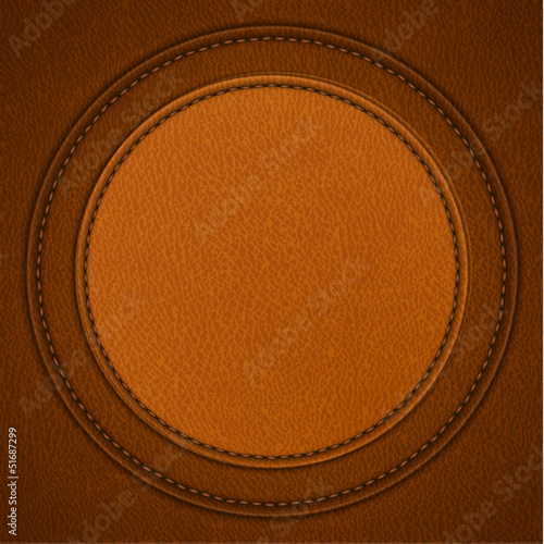 Leather background with round stitched labels