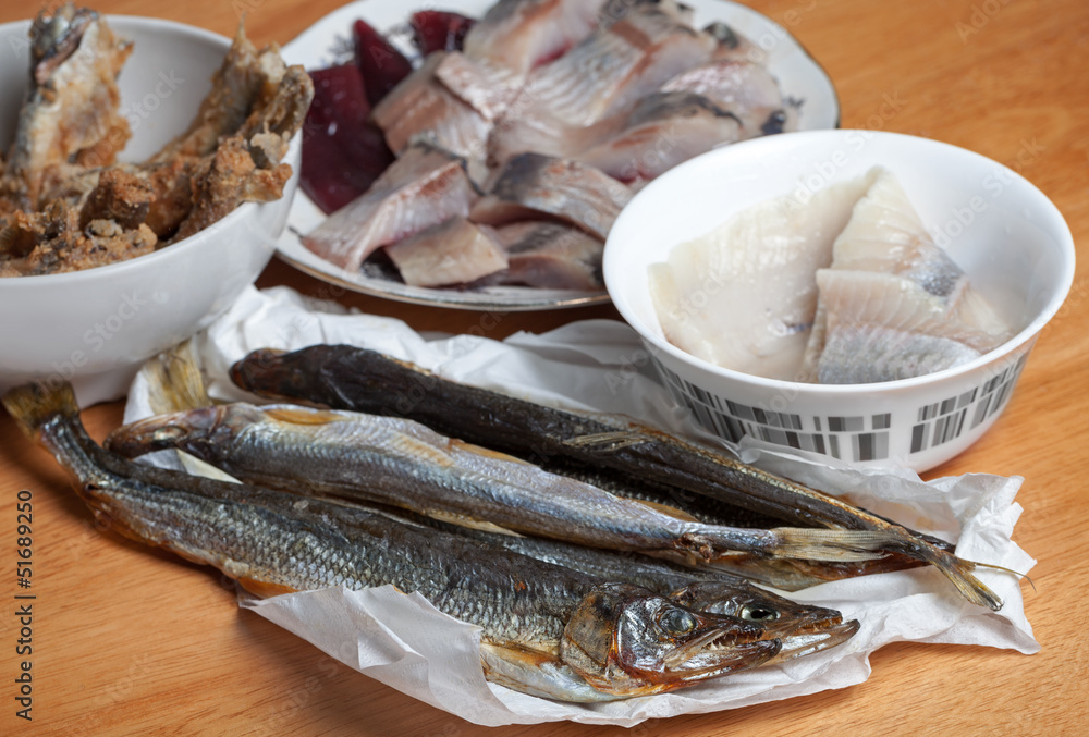 Assorted fish on wooden table. Seafood theme Assorted fish on wooden table. Seafood theme
