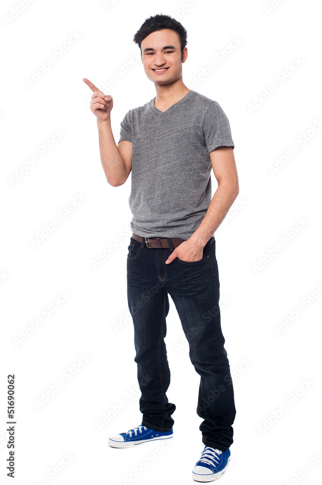 Young man pointing at something interesting Young man pointing at something interesting