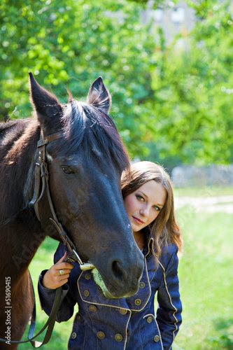 Portrait of a young girl with a horse. © lenkusa