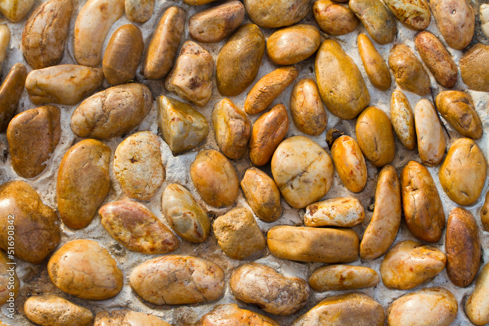 Rounded pebble stones floor for a foot massage, step on Rounded pebble stones floor for a foot massage, step on
