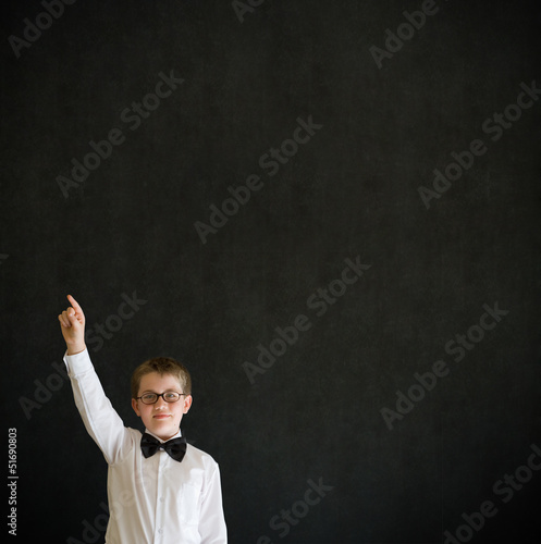 School boy hands up answering question