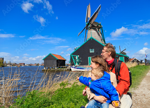 Canvas Print family near windmill in Holland