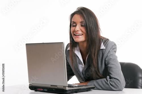Beautiful young woman working with laptop