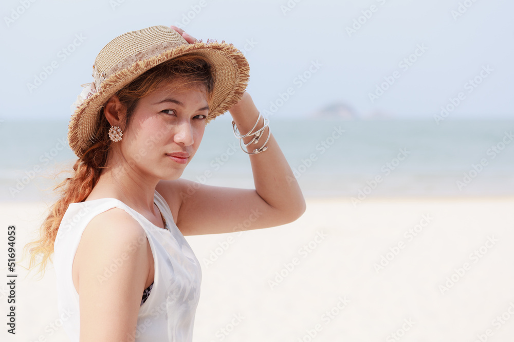 Woman wear hat on beach