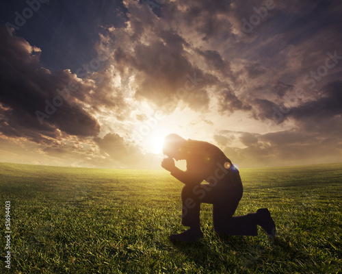 Slika na platnu Praying at sunset