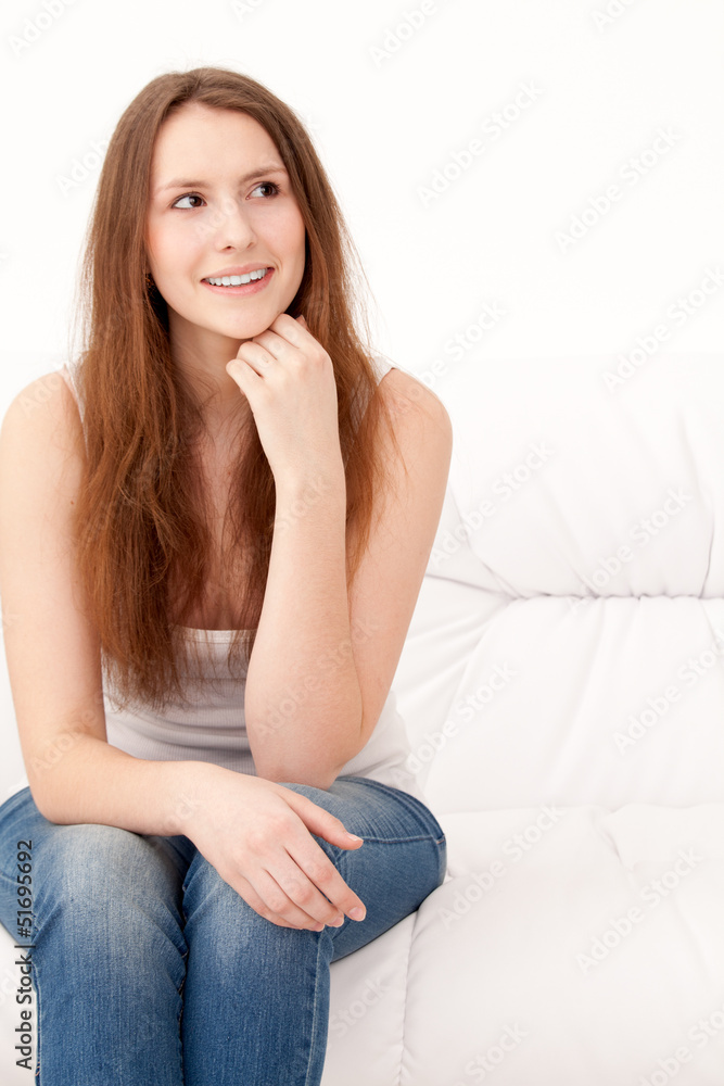 woman sitting on sofa woman sitting on sofa
