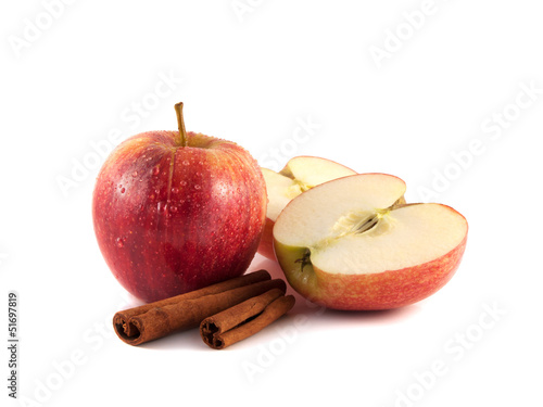 Isolated wet red apple with half and cinnamon