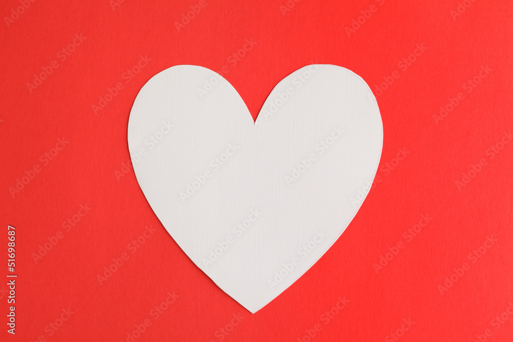 Heart shape paper over red paper background