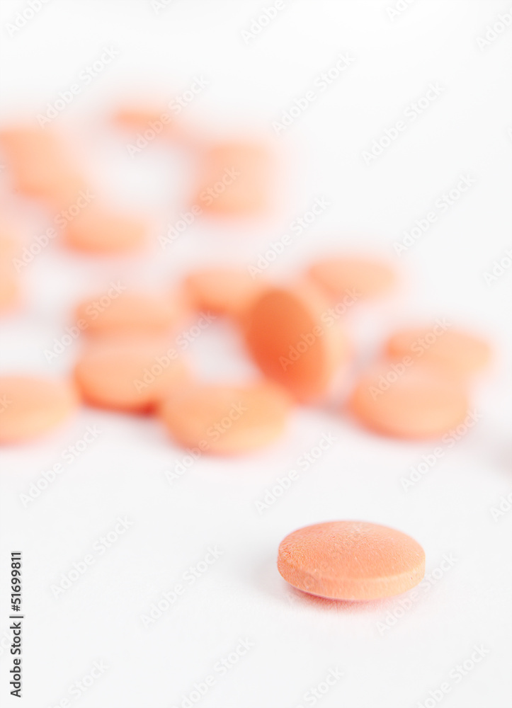 Close up of red colored pills, isolated on white Close up of red colored pills, isolated on white