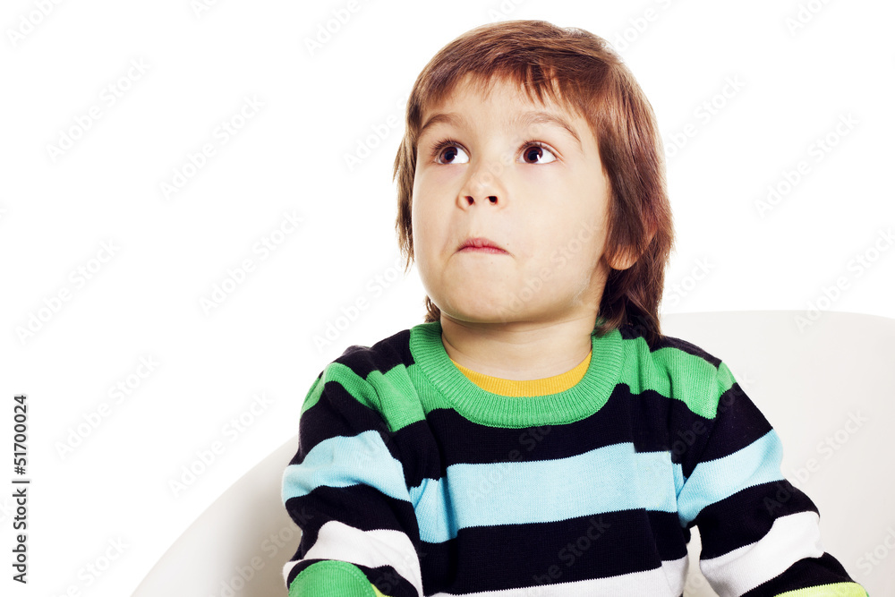 Little boy looking up with a surprised face Little boy looking up with a surprised face