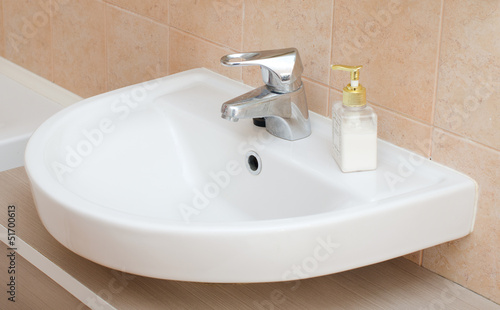 White sink in bathroom interior