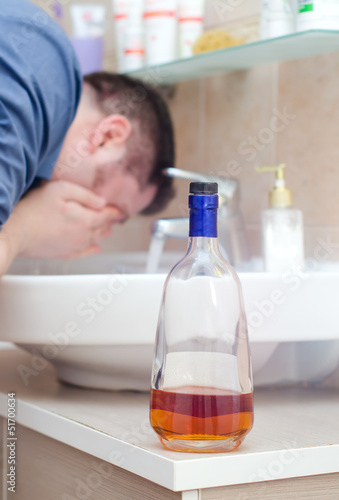 Принти на полотні Man with hangover washing up