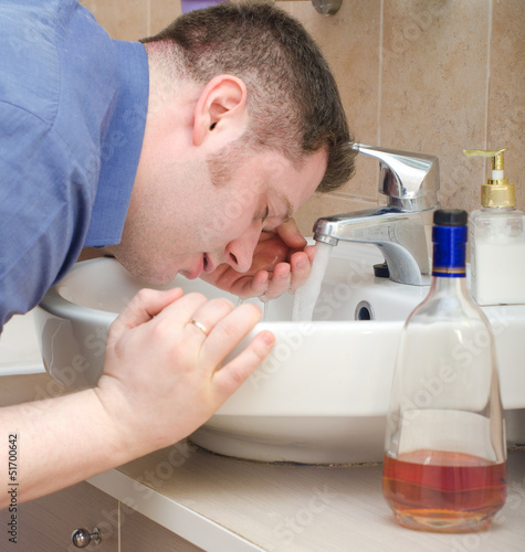 Obraz na płótnie Man with hangover washing up