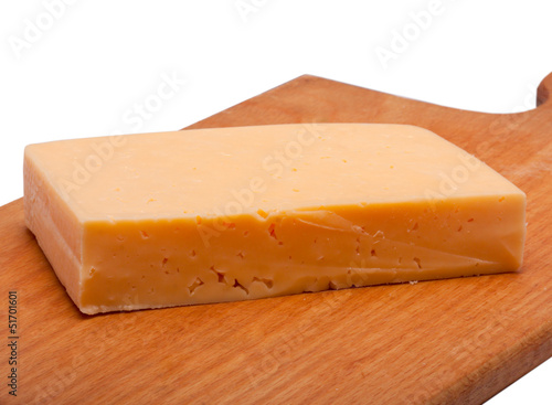 cheese on wooden board