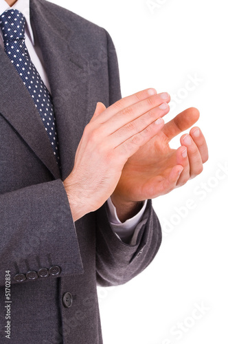 Businessman clapping his hands.
